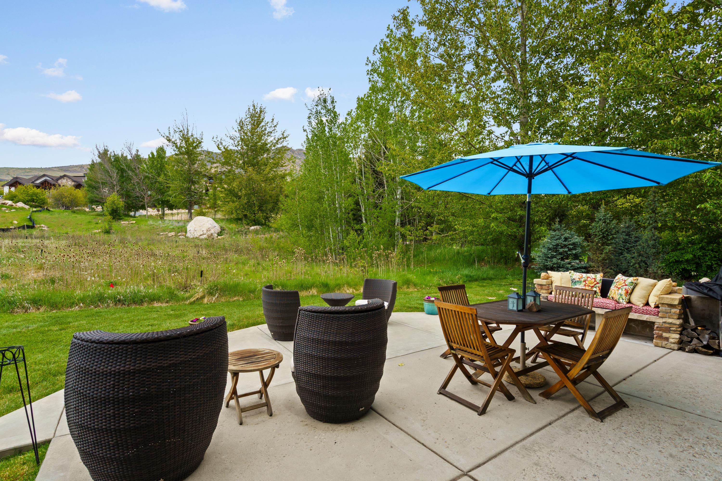 Expansive concrete patio offering open-air entertaining space