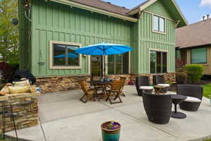 Expansive concrete patio offering multiple seating areas