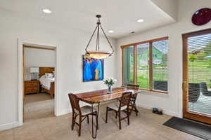 Dining area featuring recessed lighting and a decorative chandelier