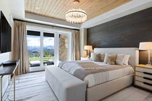 Hardwood plank ceiling complemented by a contemporary chandelier