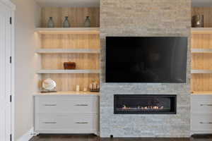 Stacked stone fireplace with a mounted television