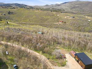 Expansive natural landscape featuring rolling hills and abundant trees