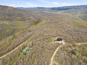 Expansive mountainous terrain featuring multiple structures and natural landscapes