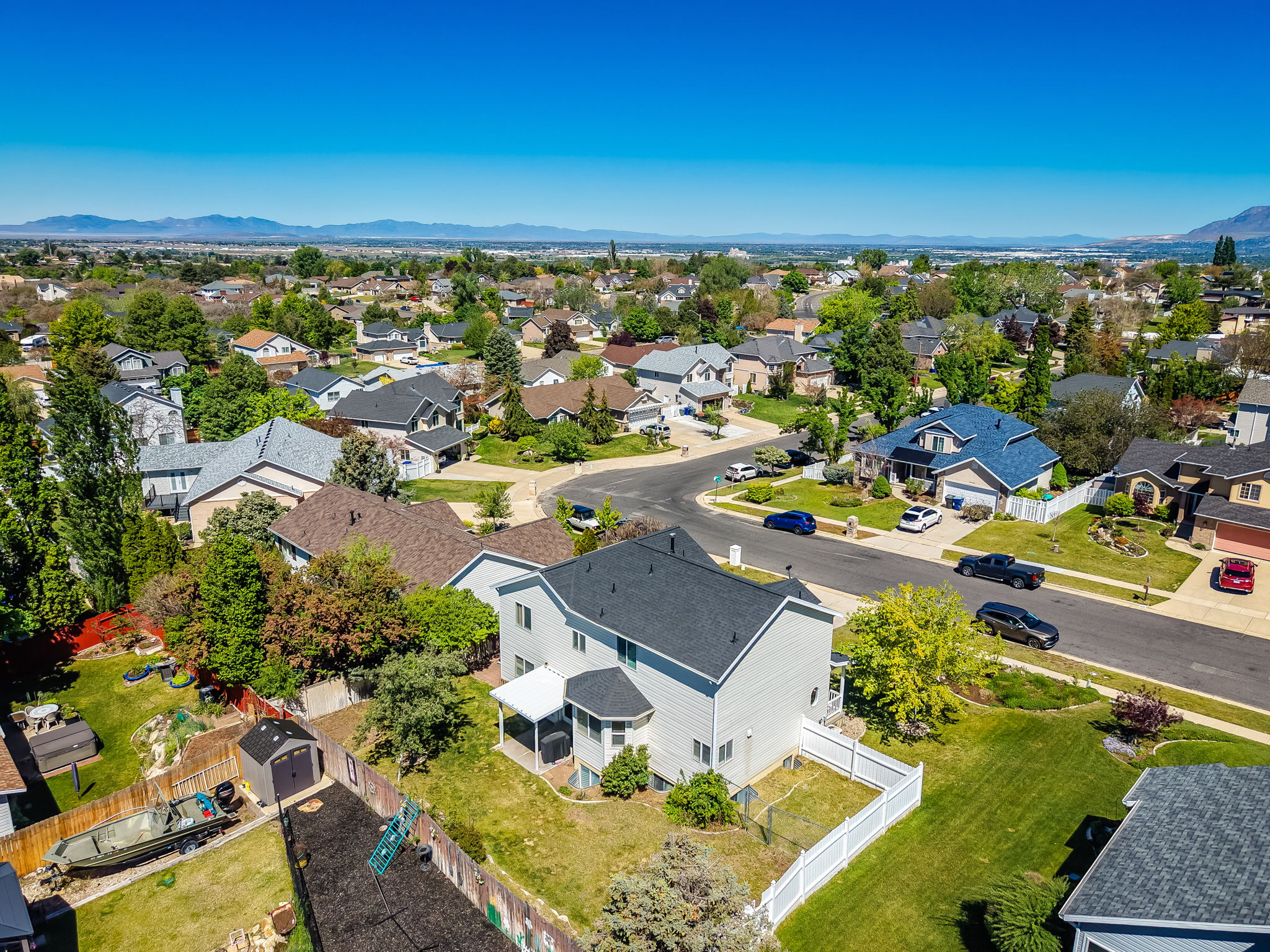 Suburban neighborhood featuring a curvilinear street layout and individual residential properties