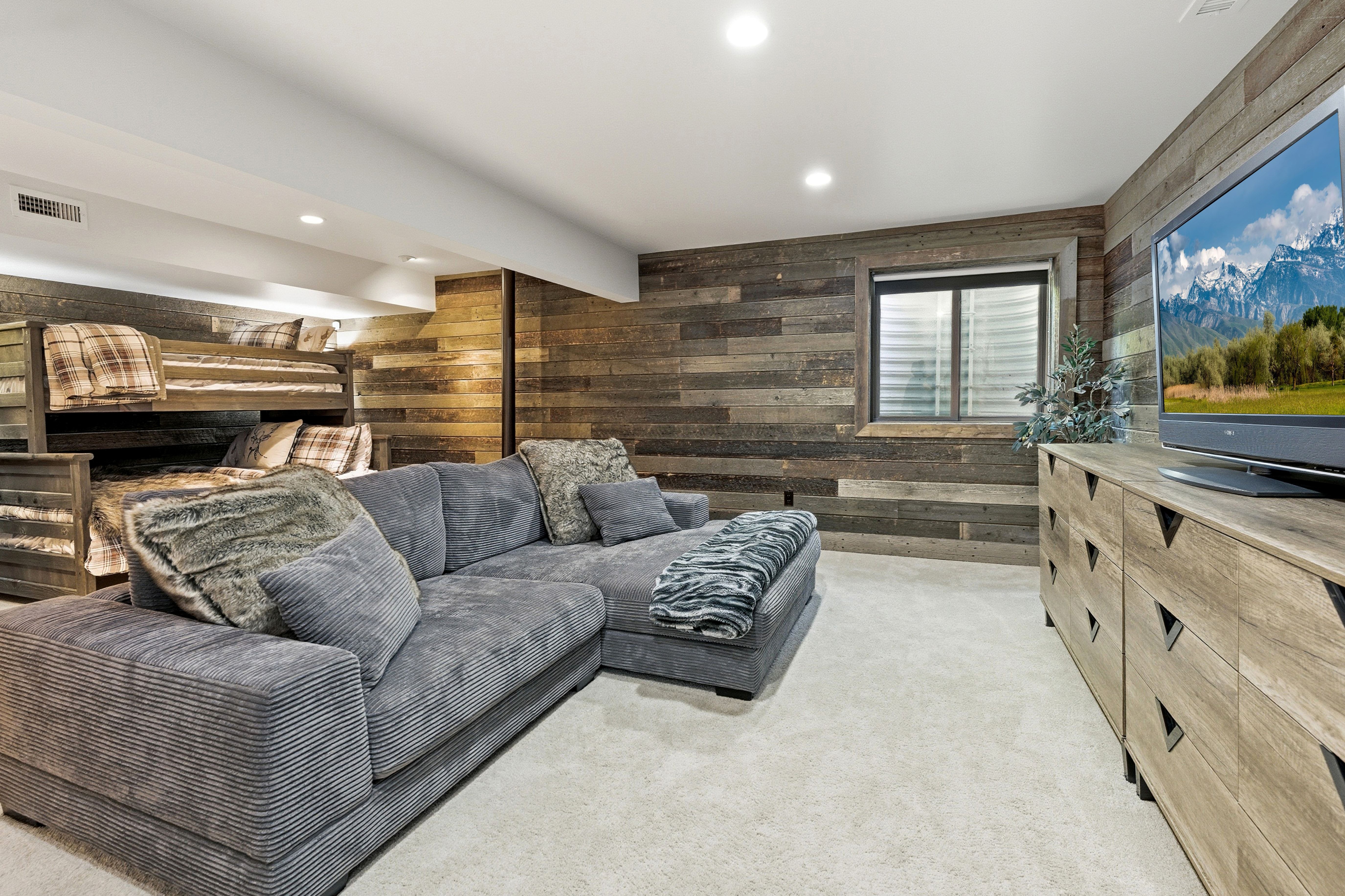 Reclaimed wood-finish wall paneling defines this living space