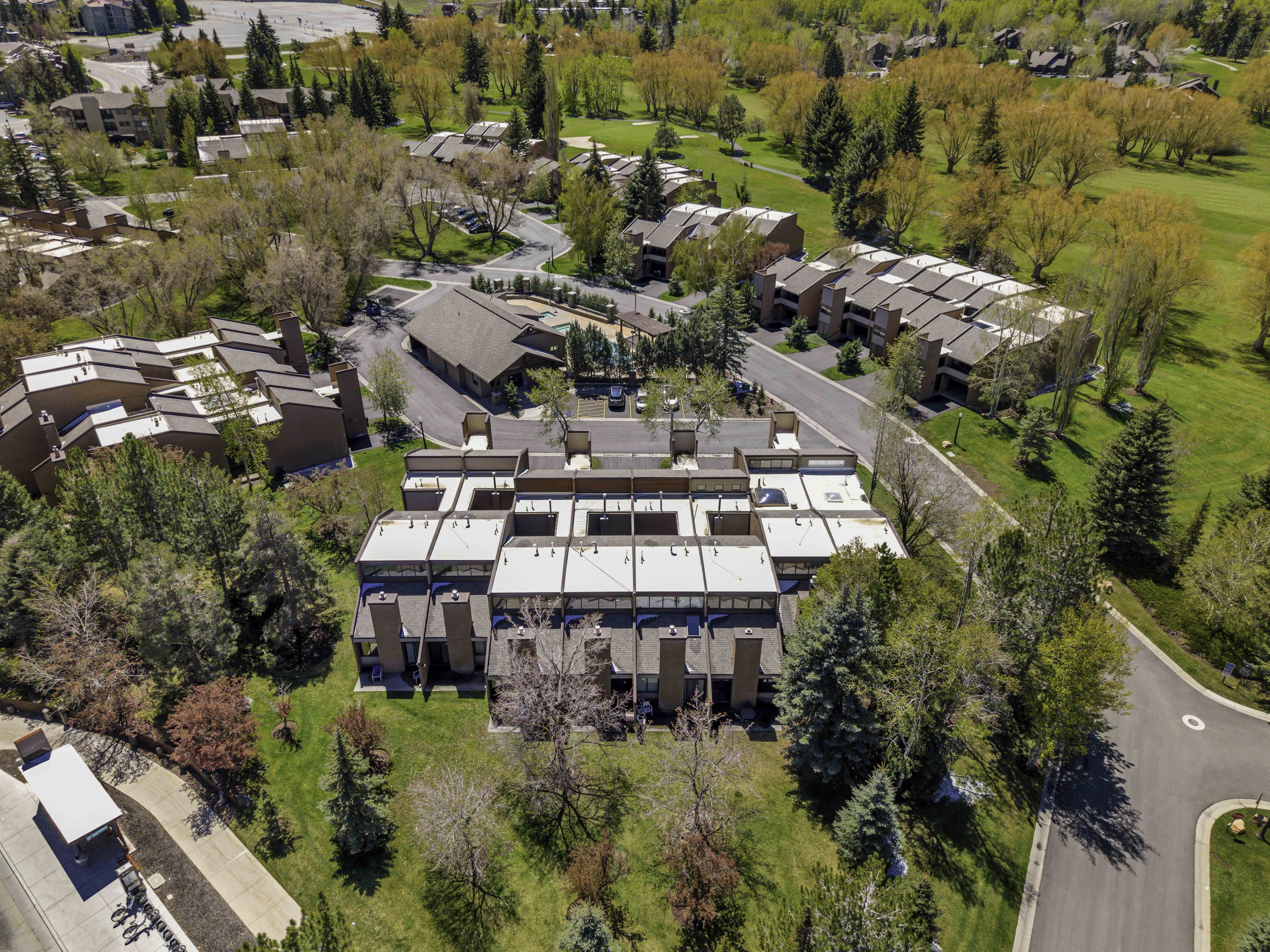 Aerial perspective of community facing South. Unit is across from the pool and clubhouse