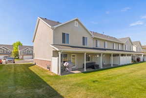 Rear exterior with a large covered patio