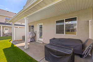 Rear exterior with a large covered patio