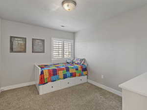 Room featuring neutral wall tones and plush carpeting