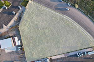 Highlighted aerial view of the 1.38-acre commercial land lease parcel with surrounding access, nearby businesses, and development momentum.