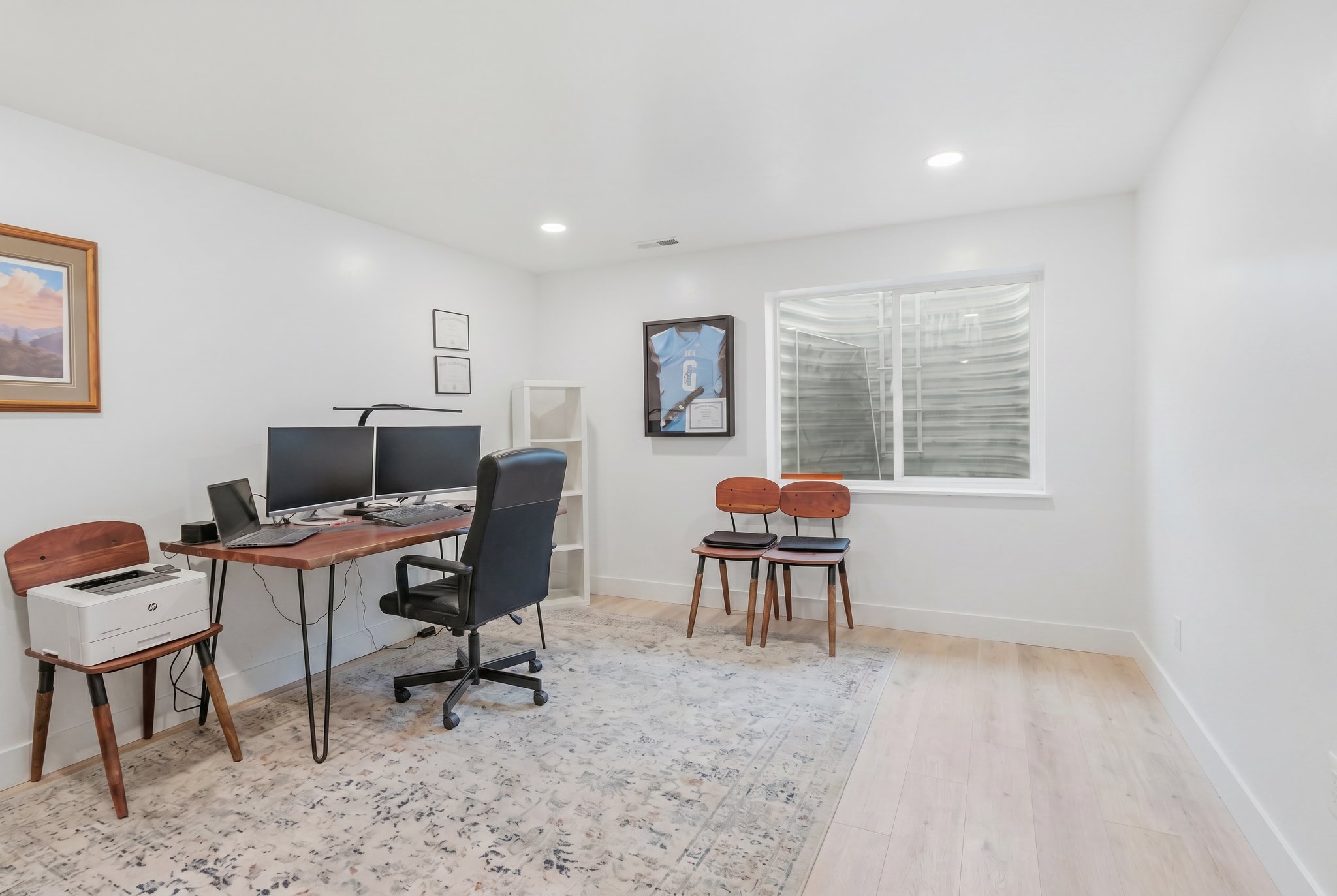 Versatile room featuring light wood-finish flooring and a single window