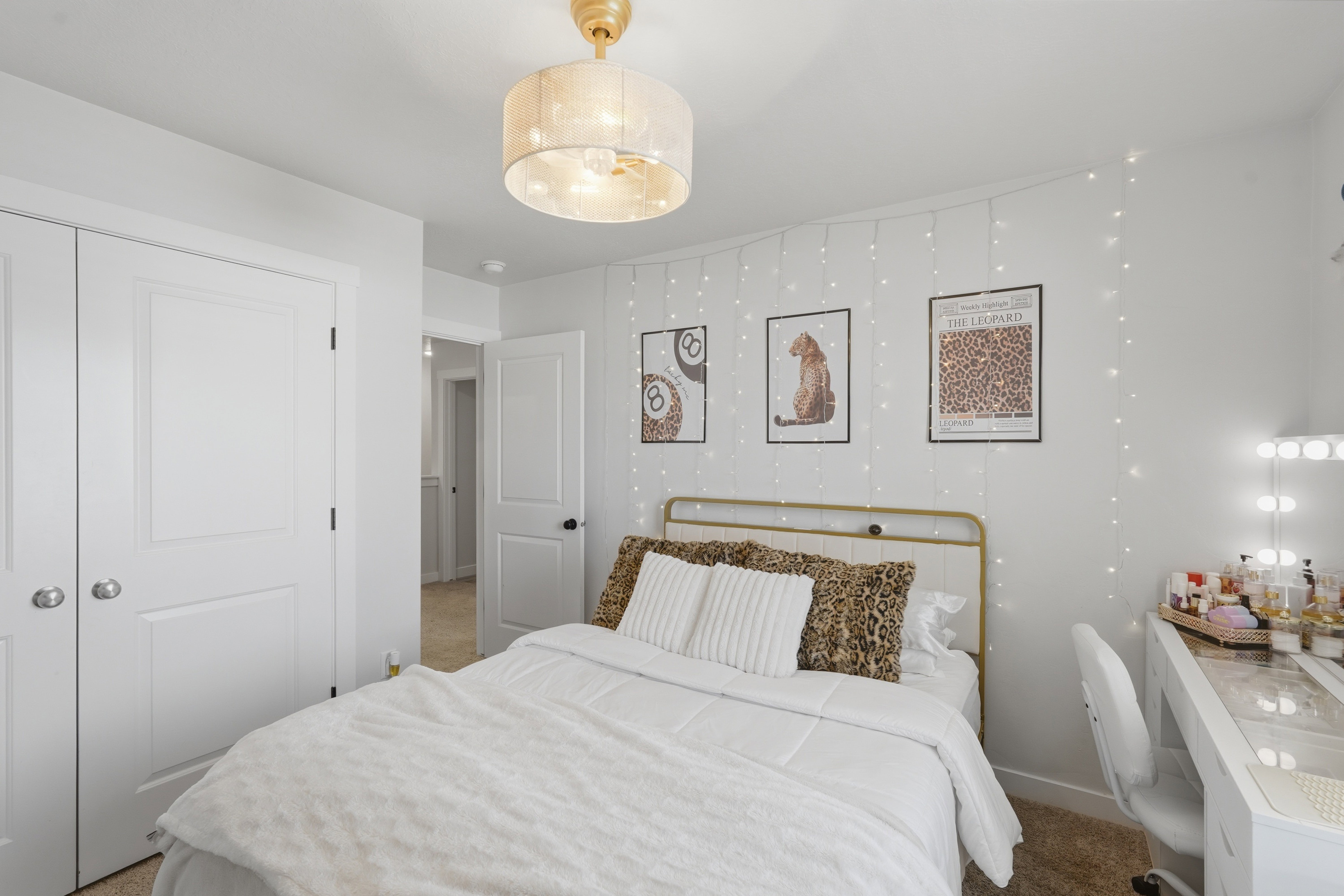 Bedroom featuring a drum pendant light fixture, white walls, and carpet flooring
