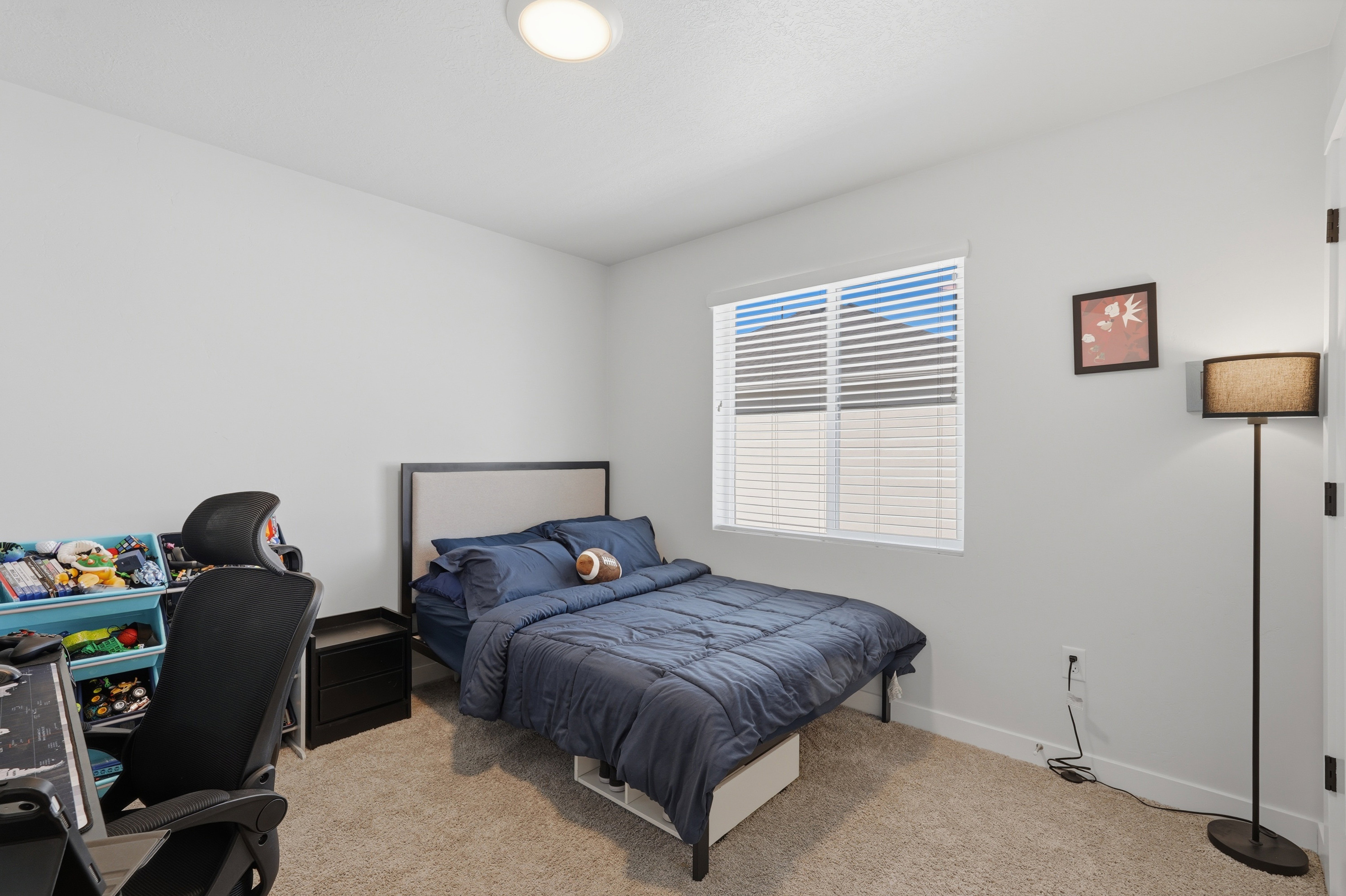 Bedroom featuring a window with white blinds, neutral wall paint, recessed lighting, and carpeted flooring