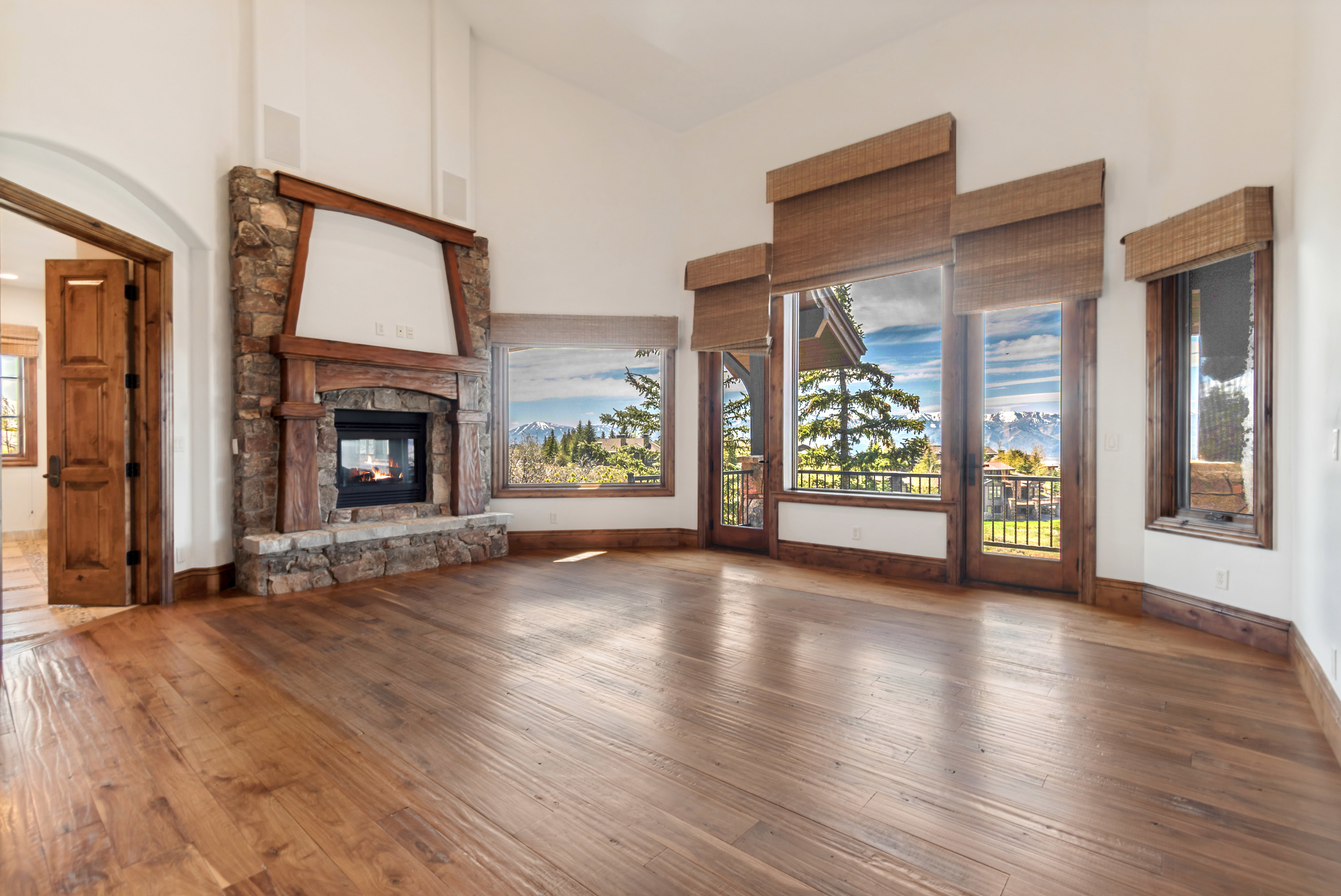 Spacious interior with high ceilings and wood-finish flooring