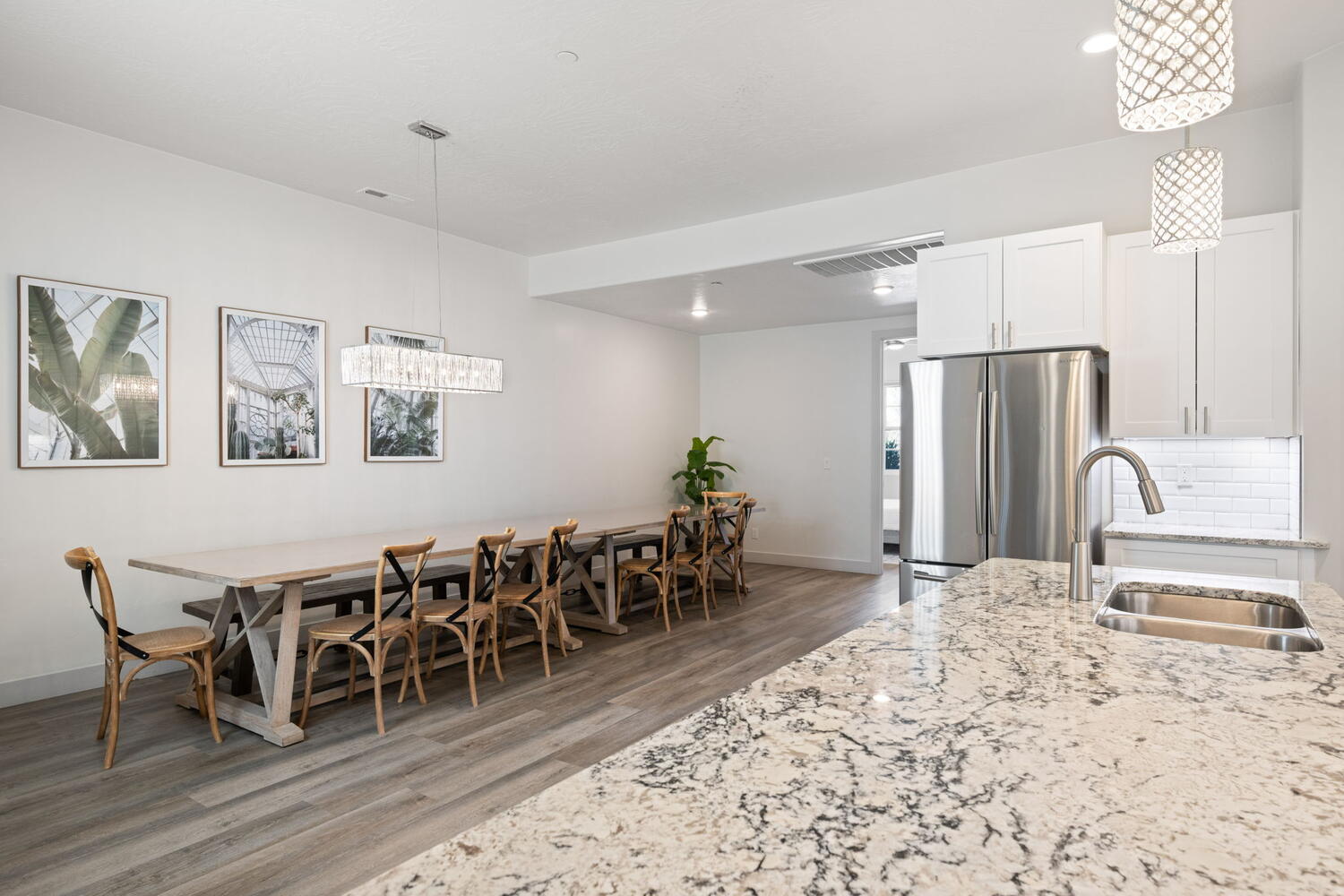 Contemporary kitchen island with a stone countertop and undermount stainless steel sink