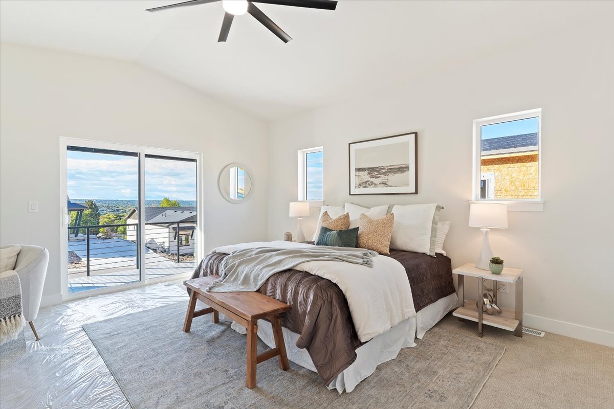Vaulted ceiling with a ceiling fan and recessed lighting