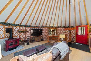 Spacious interior with exposed wooden lattice and a vaulted ceiling