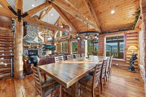 Spacious dining area featuring a prominent wood-finish table and seating for ten