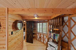 Wood-paneled interior with exposed wood beams