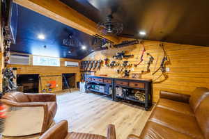 Vaulted ceiling with wood-finish beams and recessed lighting