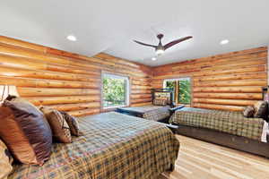 Log-style interior walls complement light wood-finish flooring