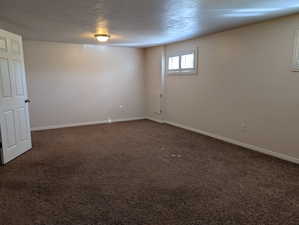 Large multipurpose room with neutral wall tones and white baseboards