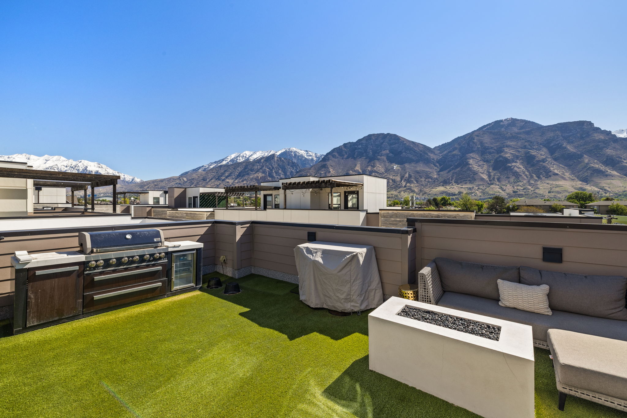 View of patio / terrace with a mountain view, grilling area, and an outdoor living space with a fire pit