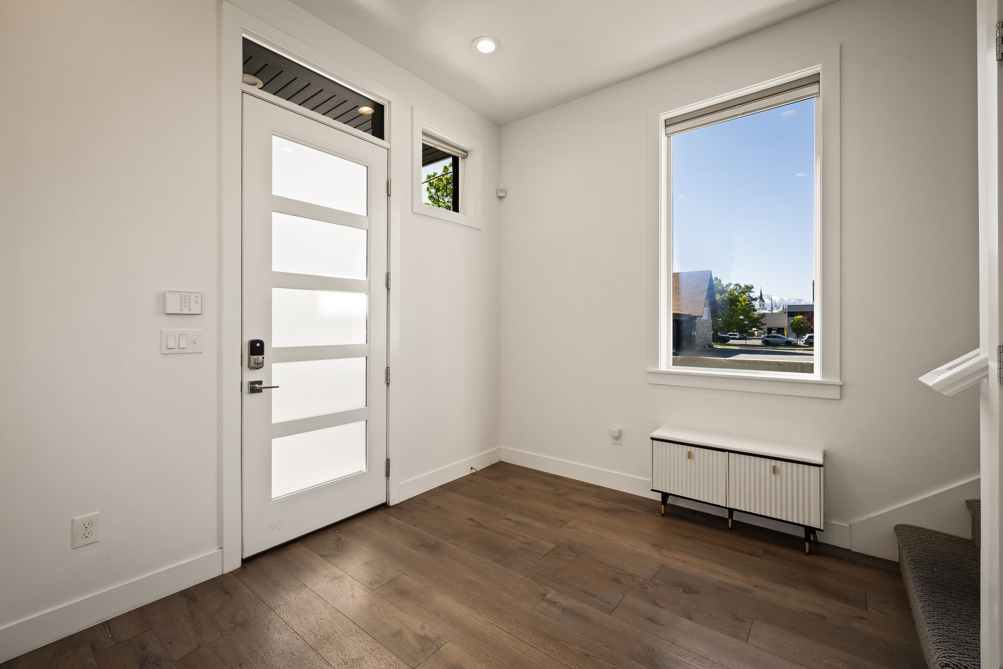 Foyer featuring radiator heating unit and dark wood finished floors