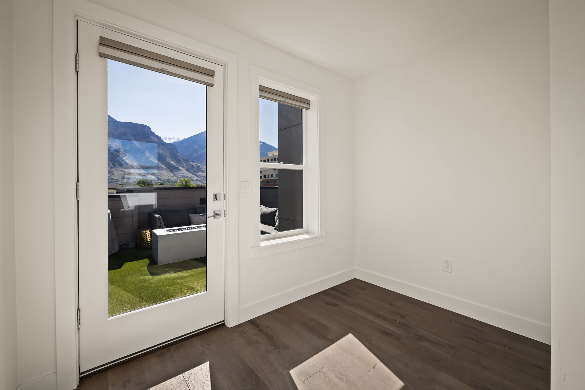 Doorway to outside featuring wood finished floors and a mountain view