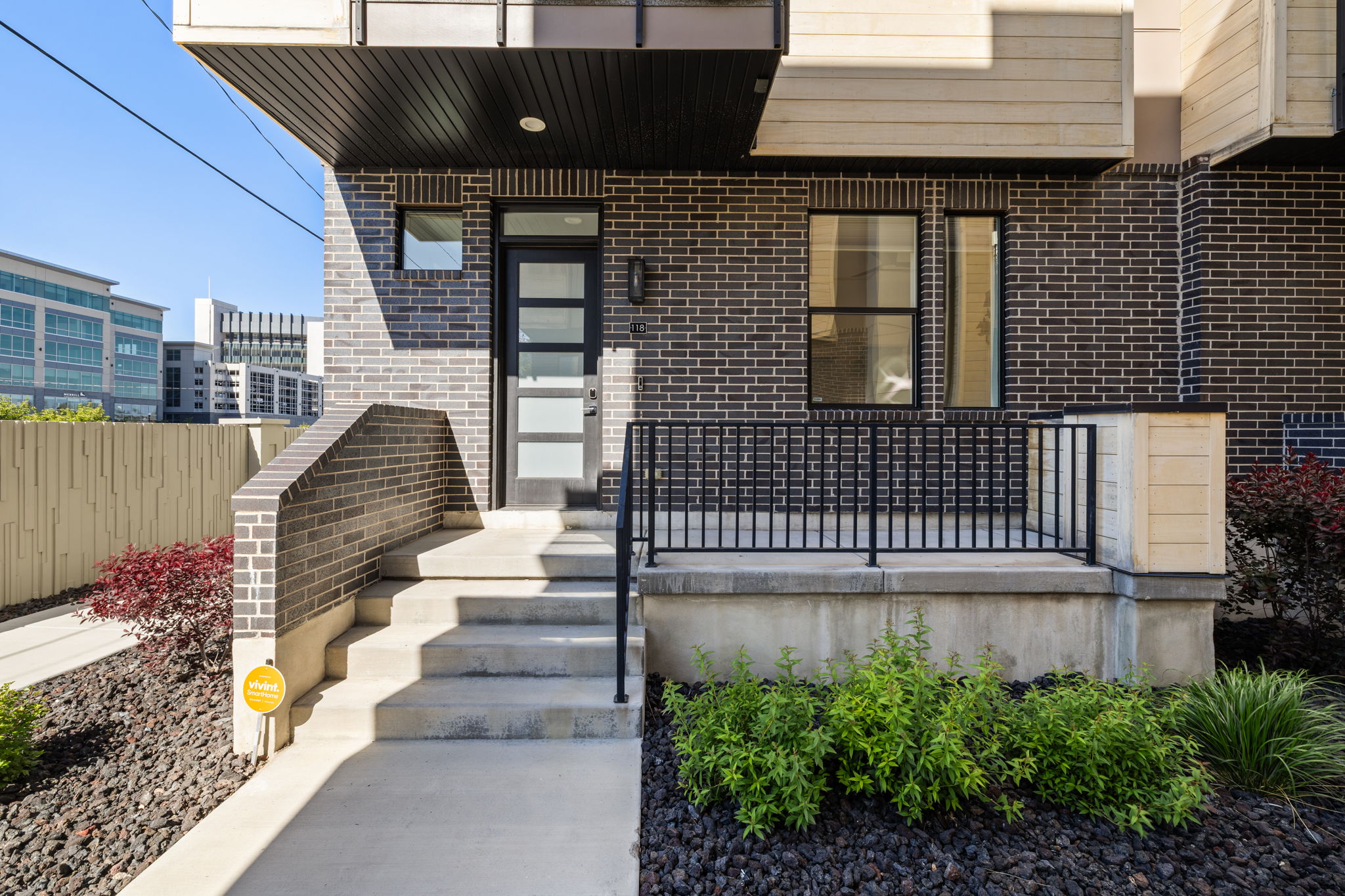 Doorway to property featuring brick siding