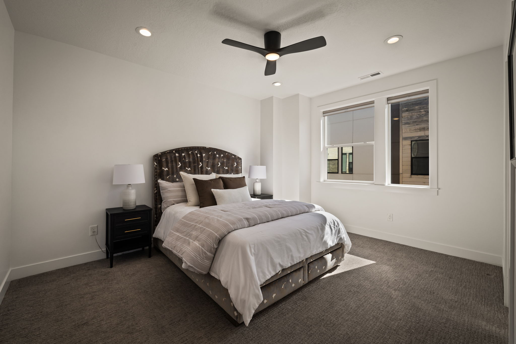 Bedroom featuring dark carpet, recessed lighting, and ceiling fan
