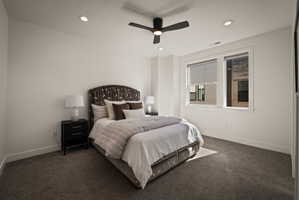 Bedroom featuring dark carpet, recessed lighting, and ceiling fan