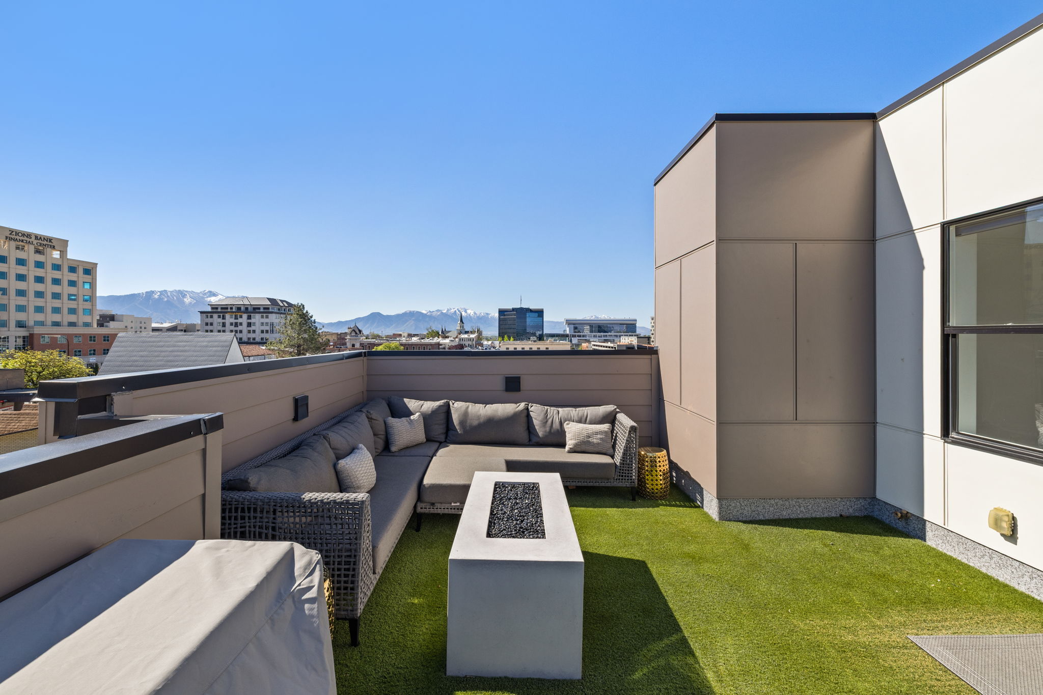 View of grassy yard featuring a patio area, outdoor lounge area, and a mountain view
