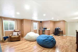 Spacious Family Room - wood cabinets and mini fridge included.