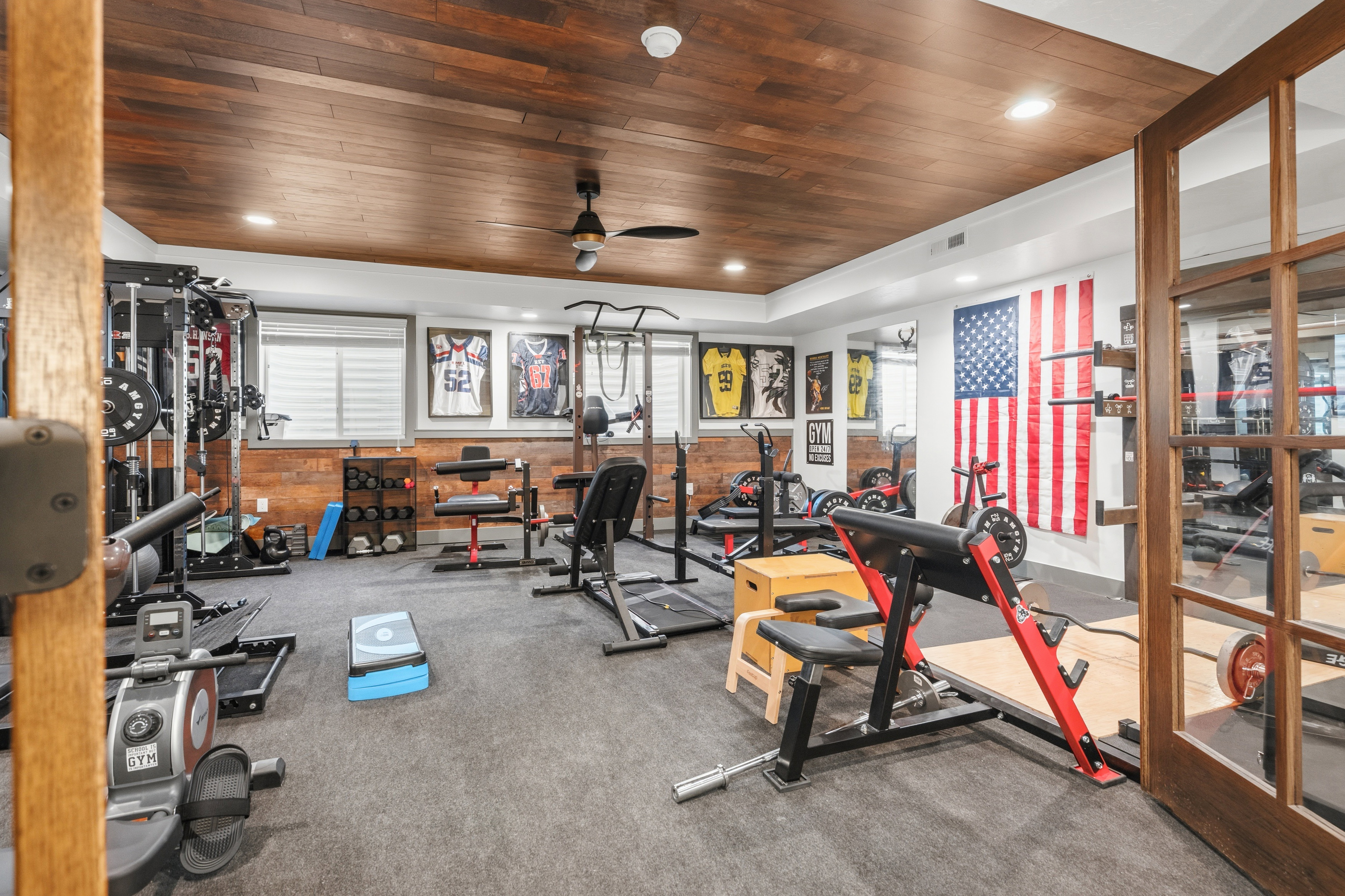 Dedicated fitness space featuring a wood-finish ceiling with recessed lighting and a ceiling fan