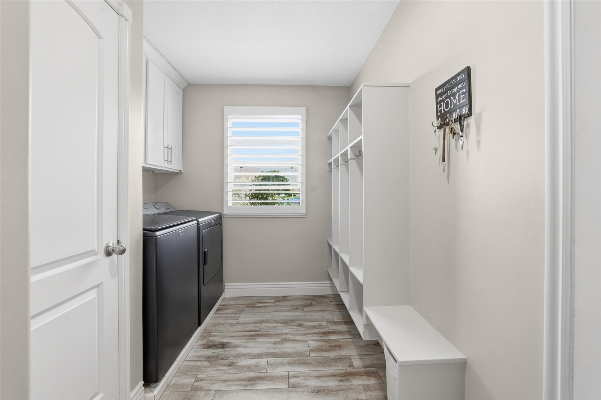 Dedicated mudroom with built-in cubbies and bench seating