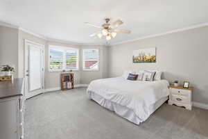 Spacious room featuring light-toned carpeting and a ceiling fan