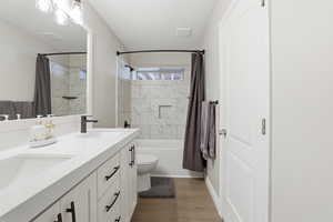 Double vanity with integrated sinks and white cabinetry