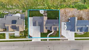 Aerial perspective showcasing the property's footprint with a blue boundary line