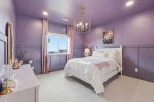 Bedroom featuring board and batten wall detailing, recessed lighting, and a decorative chandelier