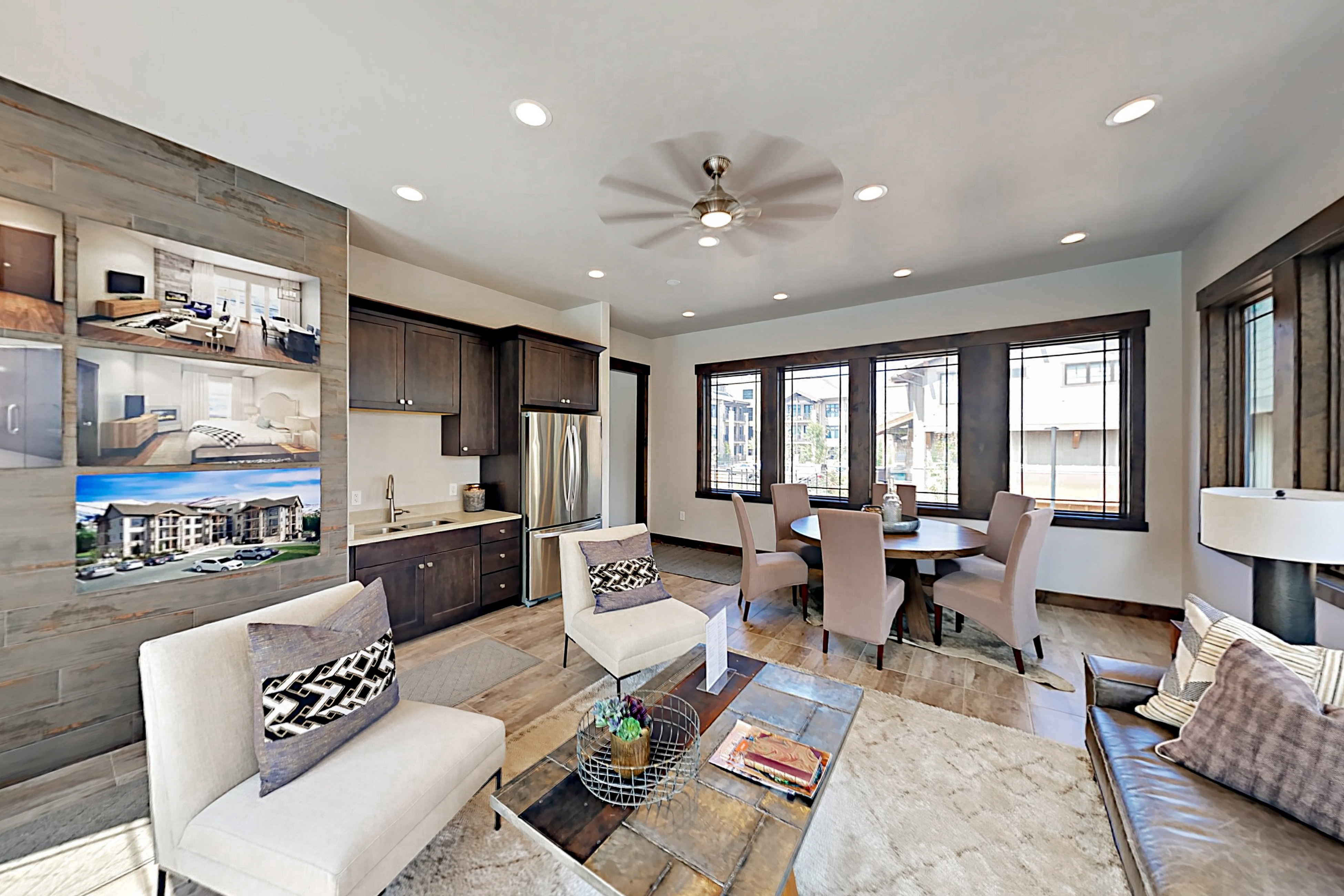 Open-concept living space with dark wood-finish cabinetry, stainless steel appliances, recessed lighting, and a ceiling fan
