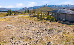 Expansive lot offering mountainous scenery and a clear sky backdrop