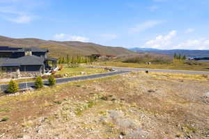 Expansive land parcel featuring natural topography and mountain scenery