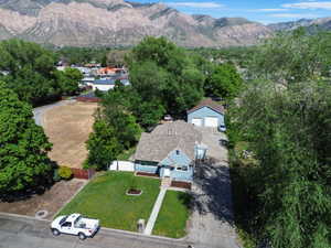 Aerial perspective showcasing a single-family residence with a detached garage