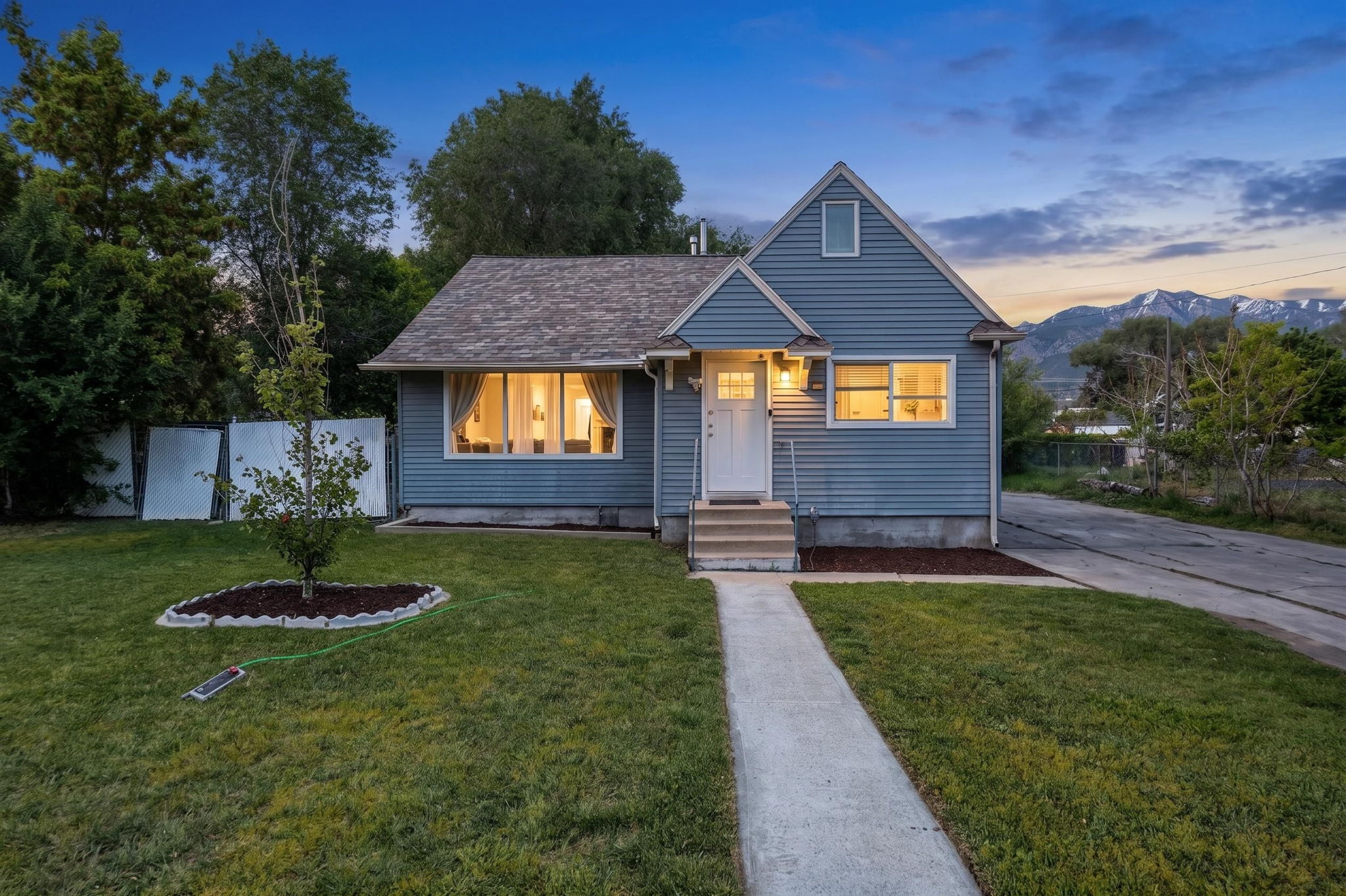 Blue siding exterior with a pitched roof