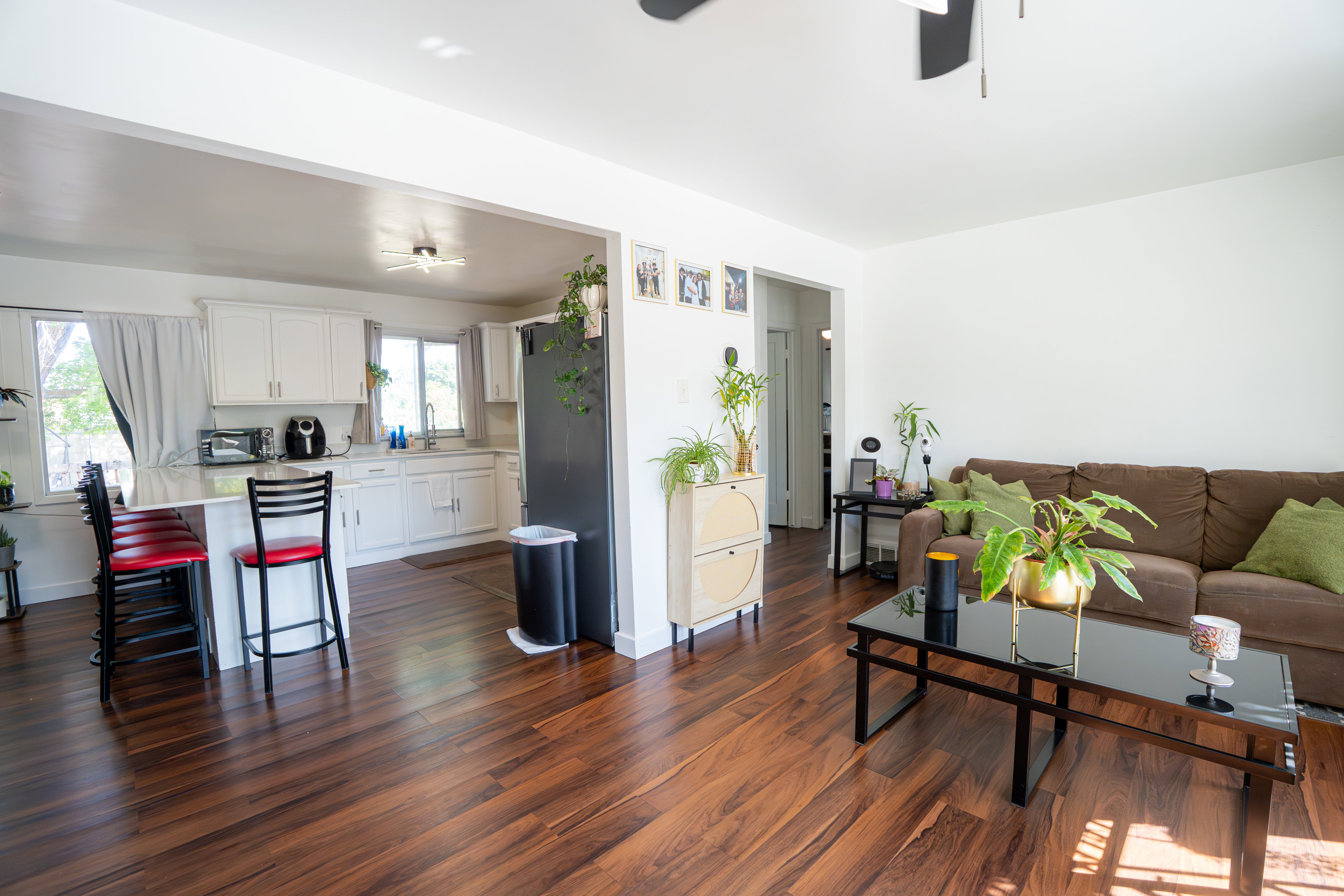 Open-concept living space featuring wood-finish flooring