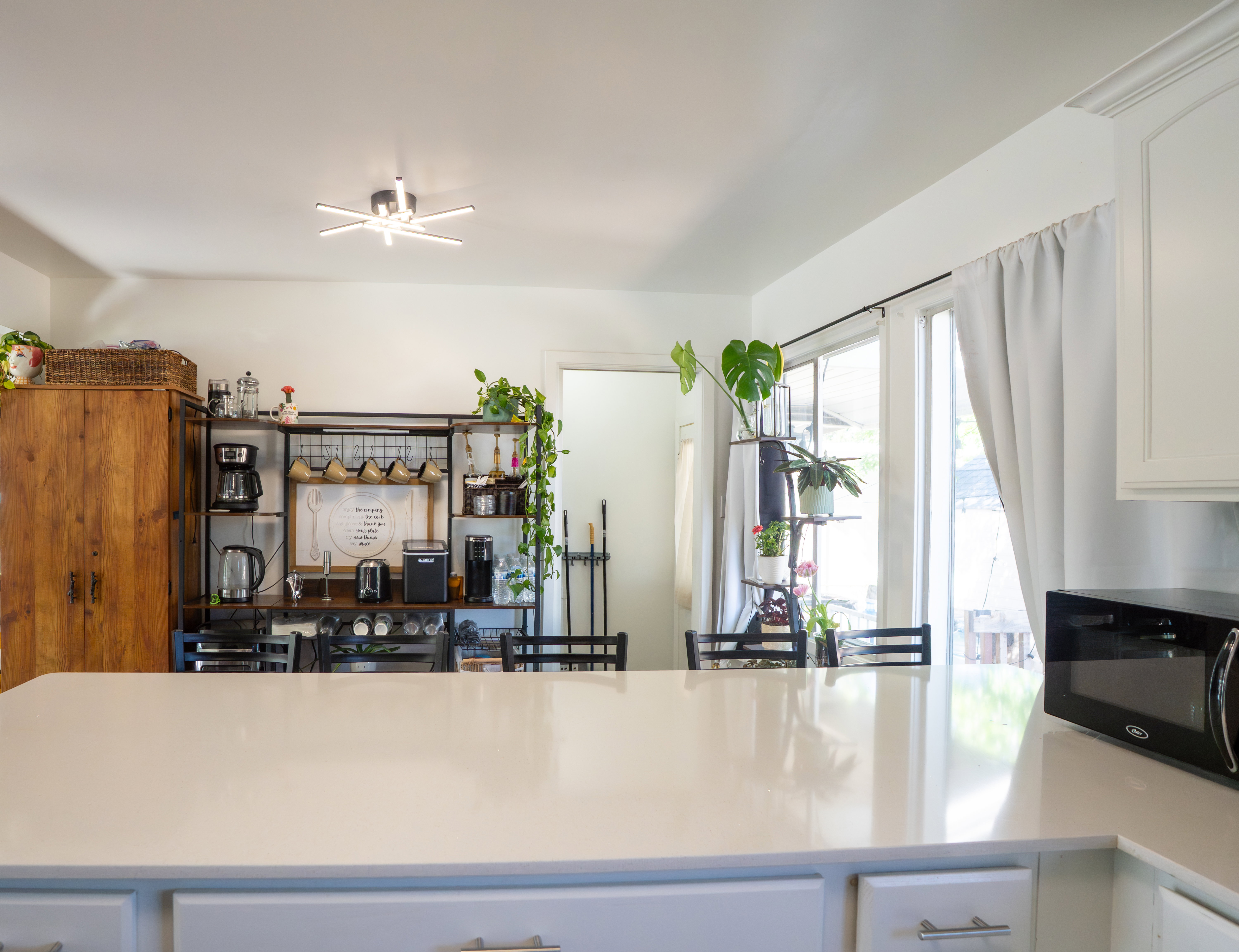 Kitchen island with a light-toned countertop and lower cabinetry
