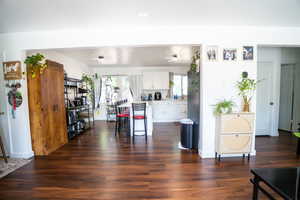 Spacious interior featuring rich wood-finish flooring throughout