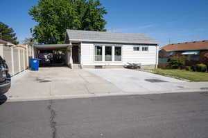 White siding exterior with a light gray shingle roof