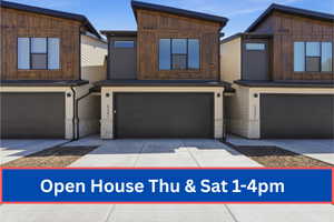 Contemporary multi-story exterior featuring a dramatic sloped roofline, wood-finish siding, dark gray horizontal paneling, and stone veneer accents